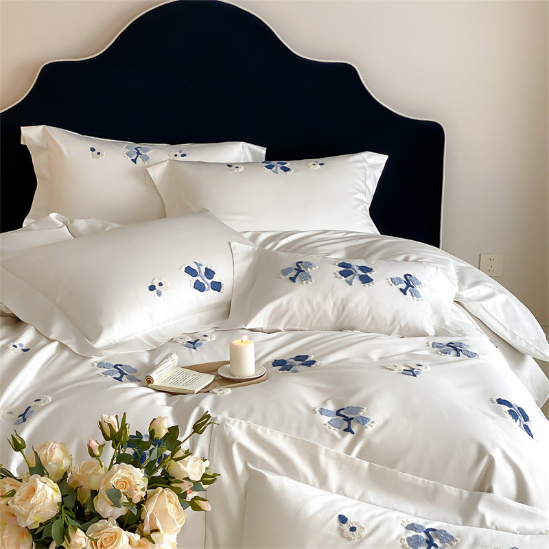 Embroidered cotton satin bedding set with subtle blue flower patterns