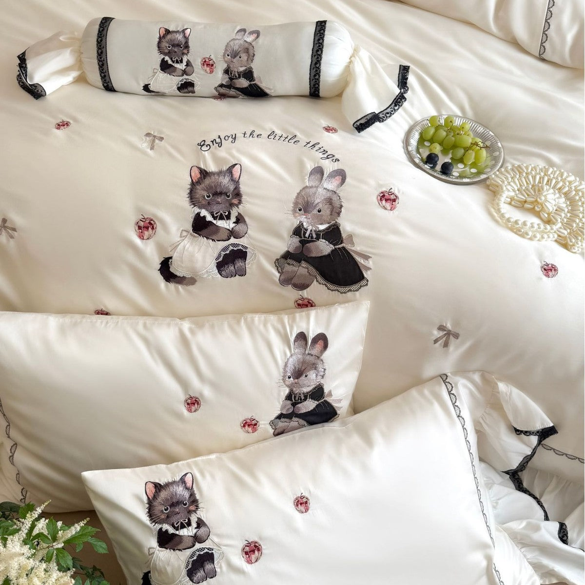 Embroidered satin bedding set with frill, ruffled hem, and animal motif