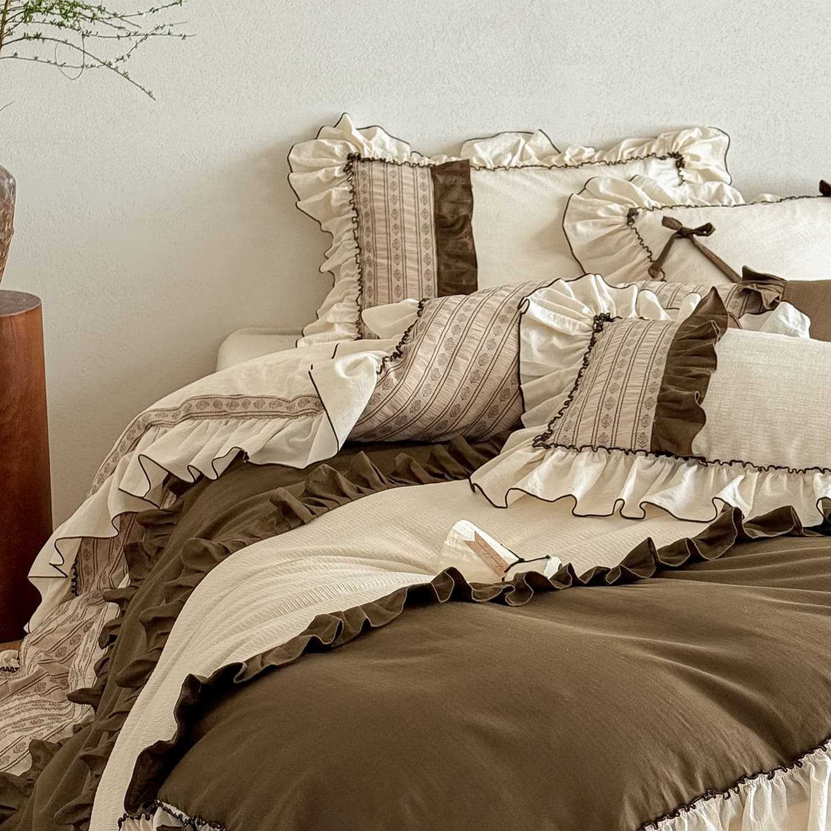 Country house style cotton-linen bedding set with ruffles, striped bedspread and decorative pillow