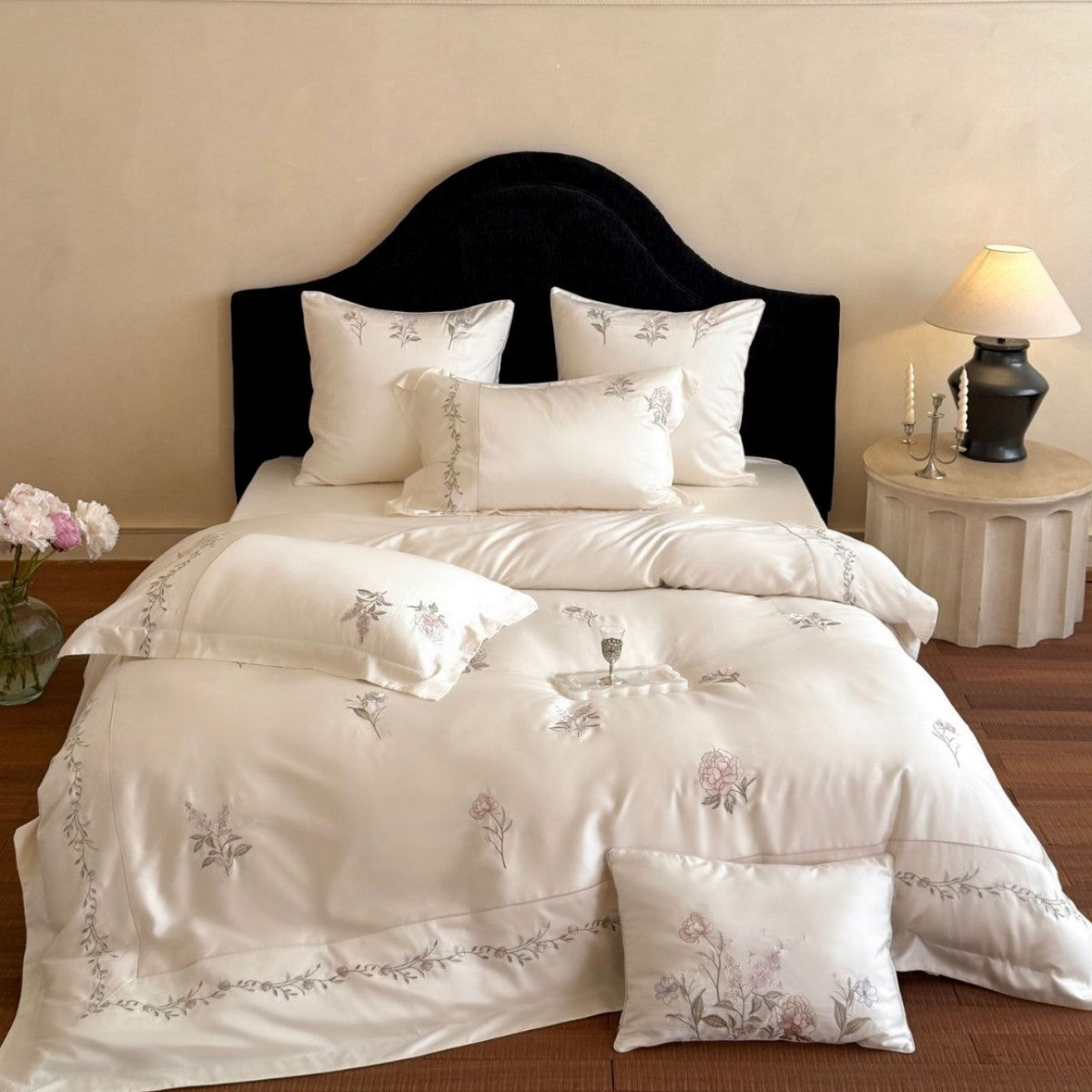 Elegant satin bedding set with fine floral embroidery and silky shiny drape