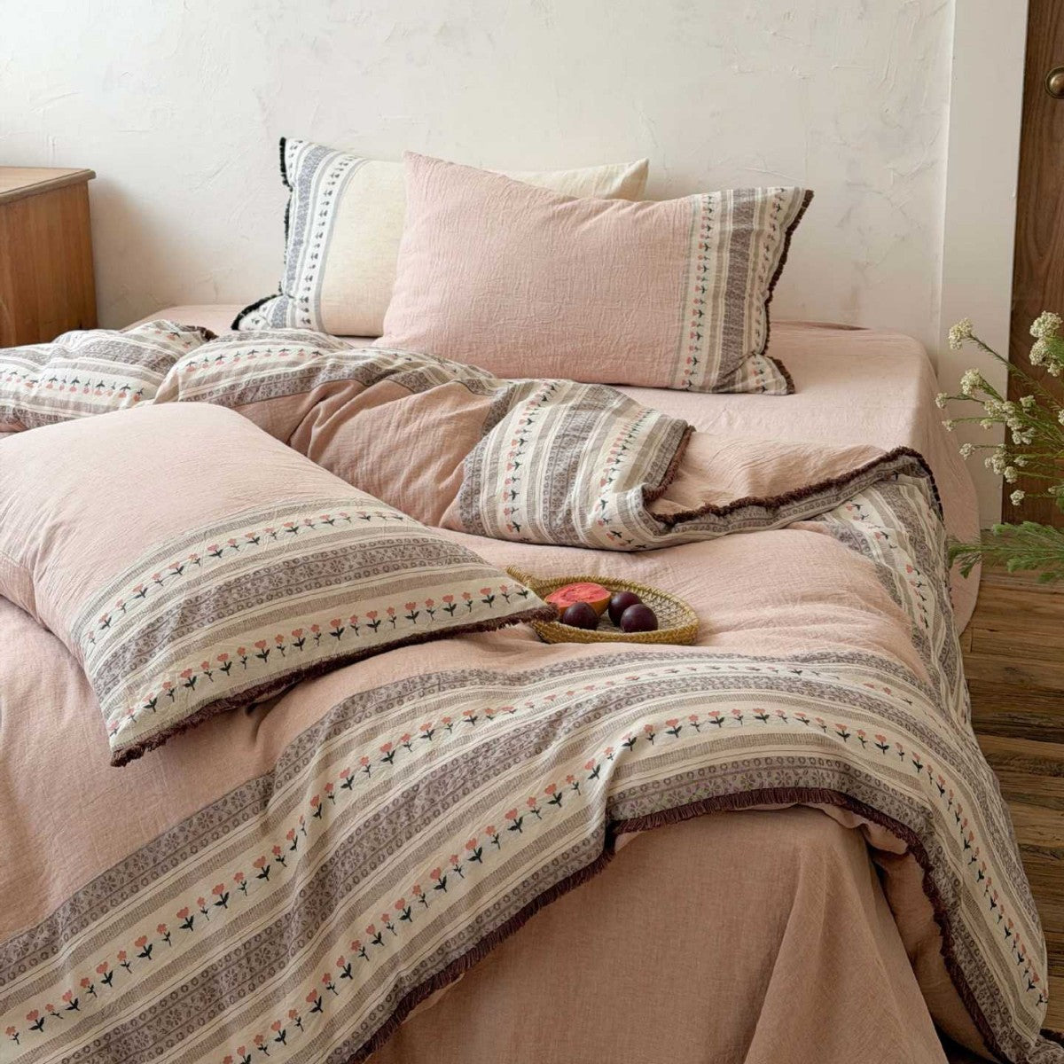 Country house style bedding set with striped floral border and fringes