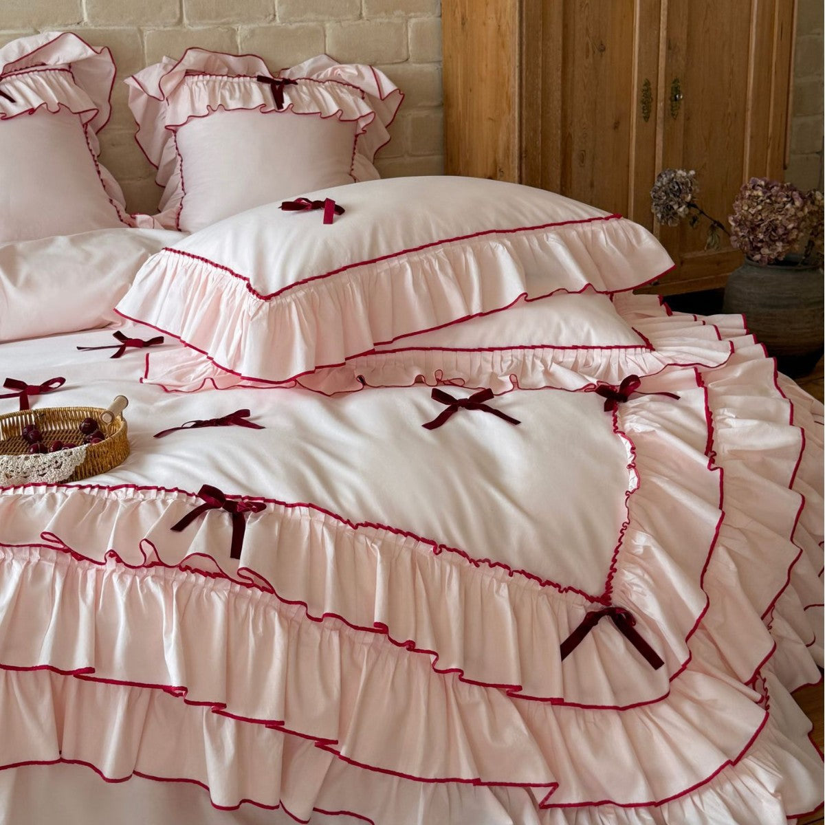 Romantic bedding set with ruffles, frills, and decorative bows