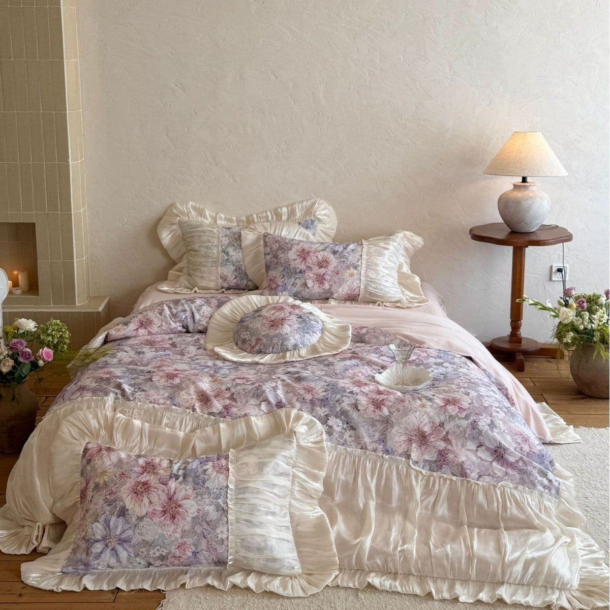 Romantic satin bedding set with floral pattern, ruffle and round cushion