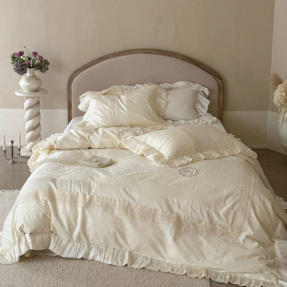 Duvet cover set with ruffle trim, fine lace border, and subtle jacquard structure