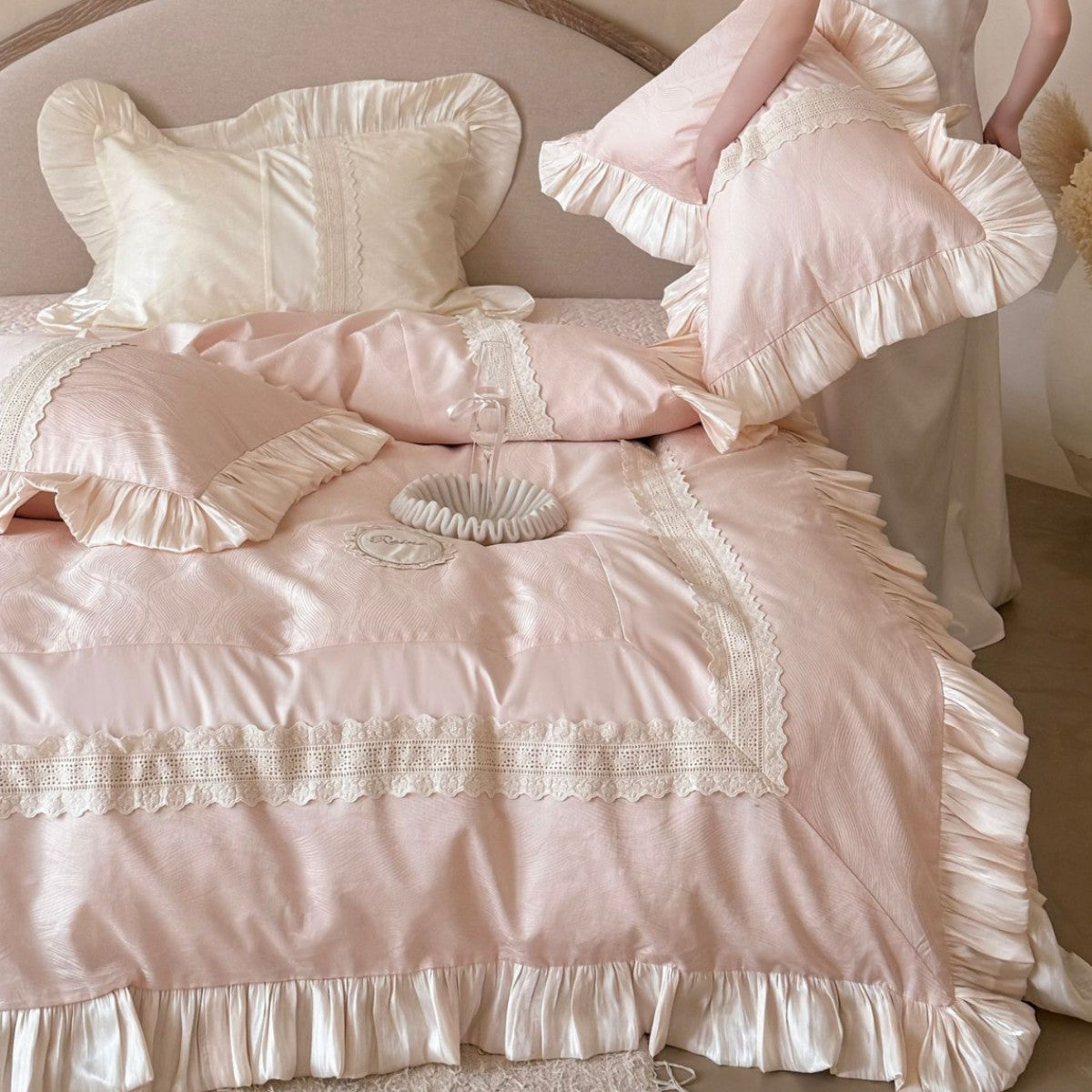 Duvet cover set with ruffle trim, fine lace border, and subtle jacquard structure