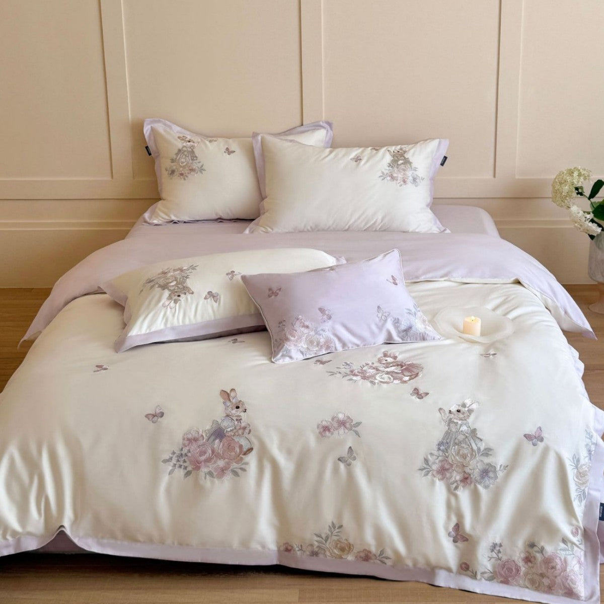 Finely embroidered bedding set with floral motifs and animal appliqués