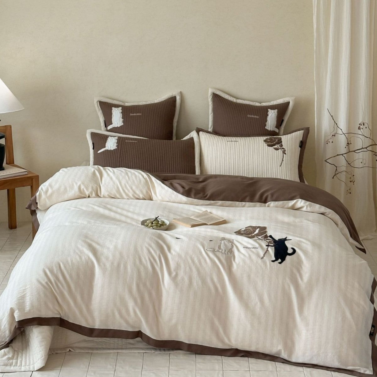 striped cotton bedding set with embroidered teddy bear appliqués and button closure