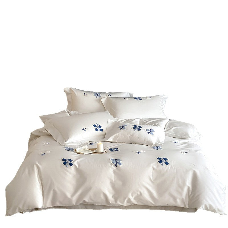Embroidered cotton satin bedding set with subtle blue flower patterns