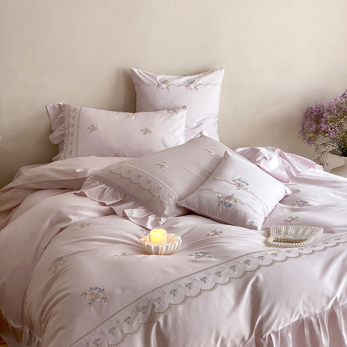 Luxurious cotton satin bedding set with floral embroidery, ruffle and decorative pillow